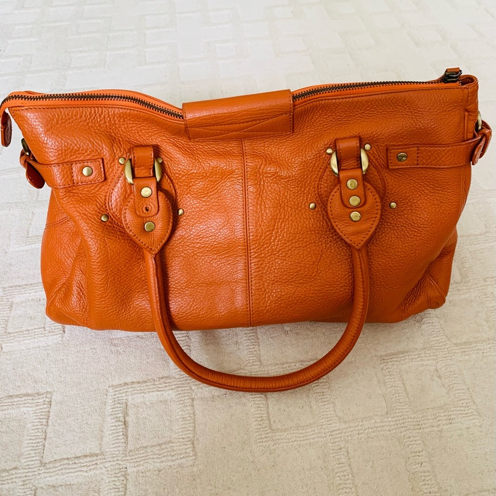 Orange leather bag.